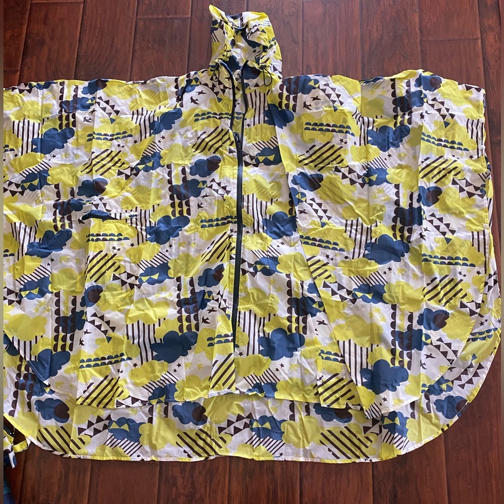 Raincoat poncho with a pouch. Never worn. NWT